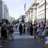 Outside New York's Metropolitan Museum of Art, hoards of people line up for Alexander McQueen's 'Savage Beauty' exhibit.